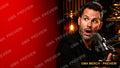Text-free podcast YouTube thumbnail of a presenter on a bold red background with a microphone